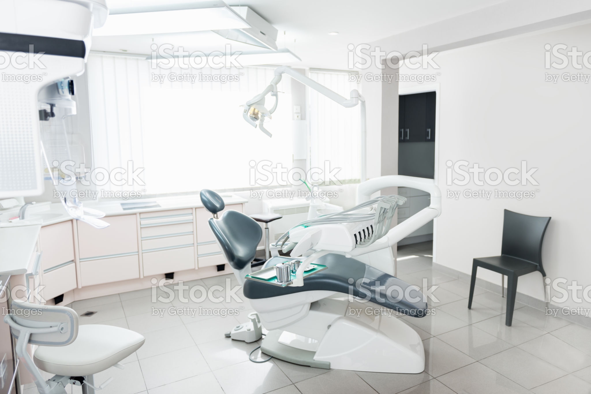 Horizontal color image of modern dental office with equipment.